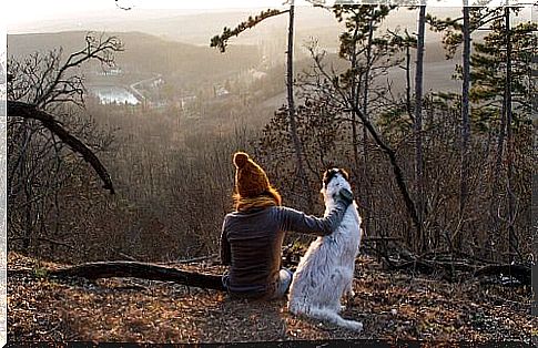 Woman with dog in the woods