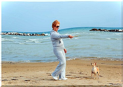 lady on the beach with the dog